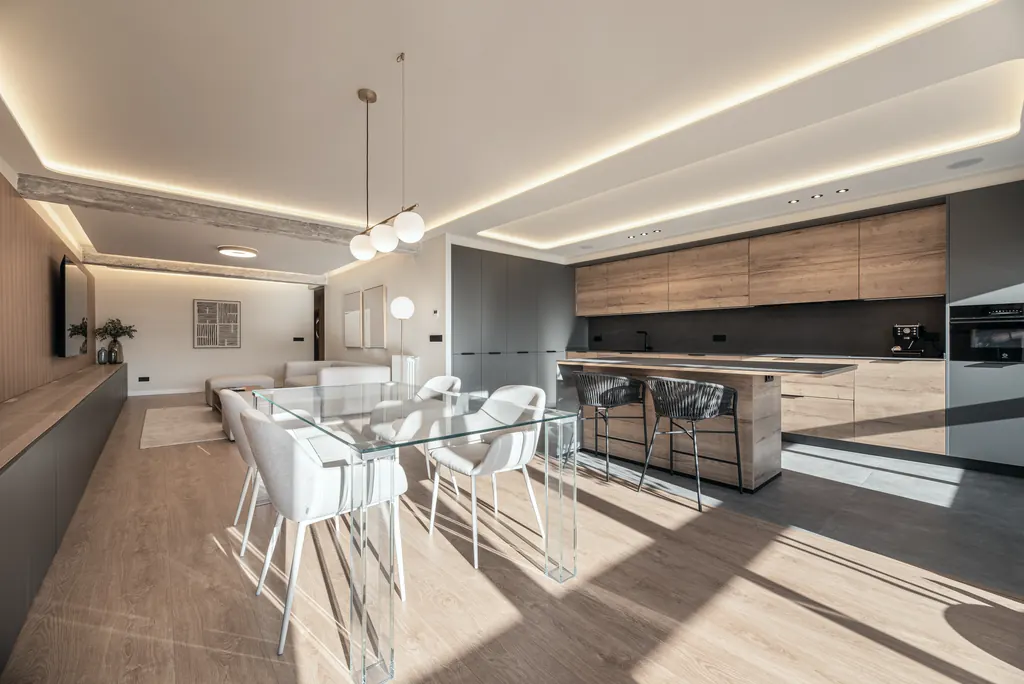 Vivienda GV88.1: comedor con mesa de cristal y cocina con isla